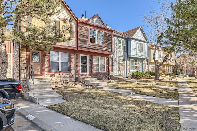 multi unit property featuring stone siding