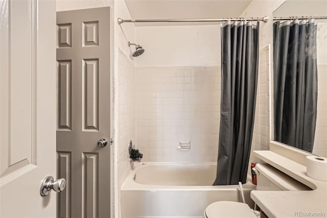 full bath with vanity, shower / tub combo, and toilet