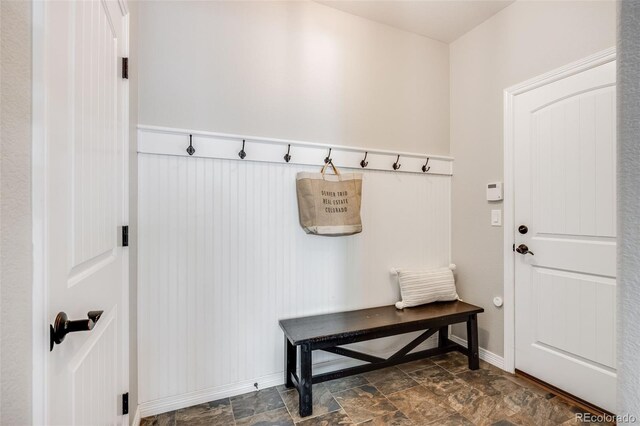 10590 Soulmark Way, Highlands Ranch, CO 80126 - mudroom with dark stone finish floors and baseboards