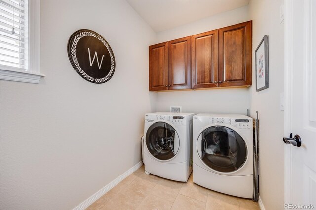 10590 Soulmark Way, Highlands Ranch, CO 80126 - laundry room with cabinet space, washer and dryer, baseboards, and light tile patterned floors