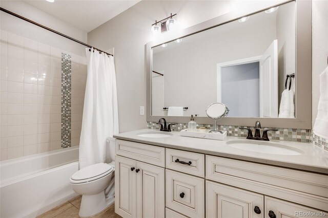 10590 Soulmark Way, Highlands Ranch, CO 80126 - full bath featuring toilet, double vanity, shower / tub combo with curtain, and tile patterned flooring