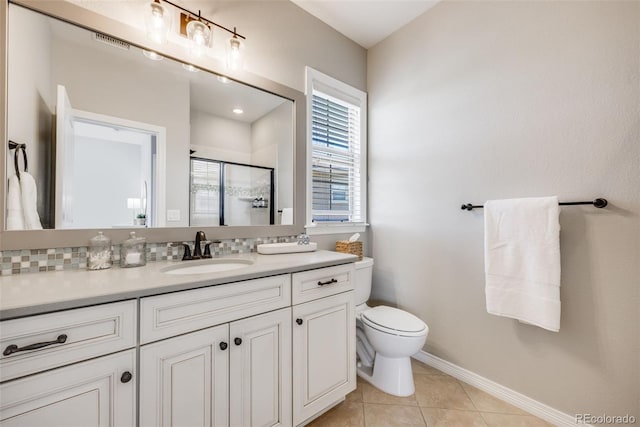 10590 Soulmark Way, Highlands Ranch, CO 80126 - full bath with a stall shower, toilet, vanity, baseboards, and tile patterned flooring