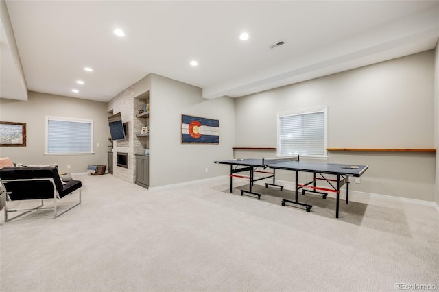 10590 Soulmark Way, Highlands Ranch, CO 80126 - recreation room featuring baseboards, recessed lighting, carpet, a fireplace, and built in shelves