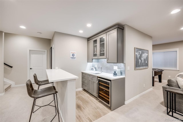10590 Soulmark Way, Highlands Ranch, CO 80126 - bar area featuring wine cooler, a sink, decorative backsplash, baseboards, and recessed lighting