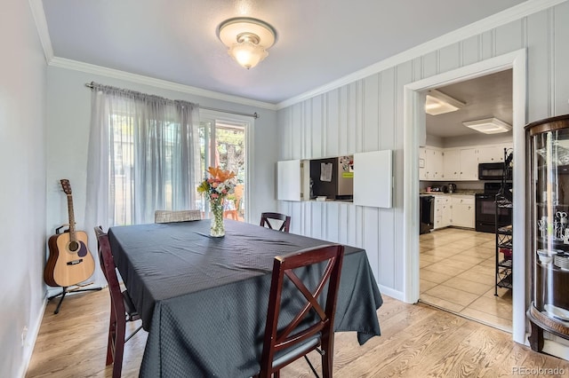 555 W Mansfield Ave, Englewood, CO 80110 - dining area featuring ornamental molding, light wood-type flooring, and baseboards