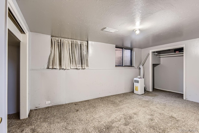 555 W Mansfield Ave, Englewood, CO 80110 - below grade area featuring carpet flooring and a textured ceiling
