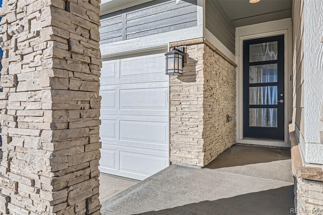 711 N Waterloo Ct, Aurora, CO 80018 - view of exterior entry featuring an attached garage