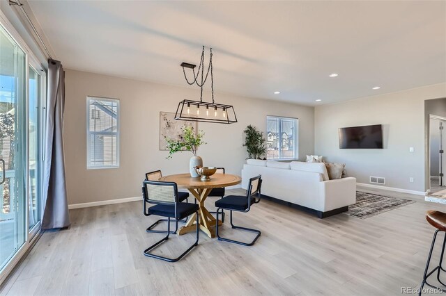 dining space featuring light hardwood / wood-style flooring