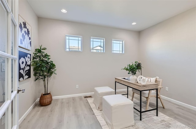 office space with light hardwood / wood-style floors