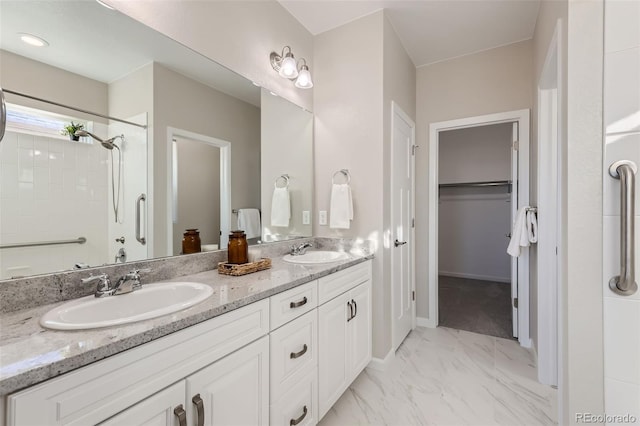 bathroom with walk in shower and vanity