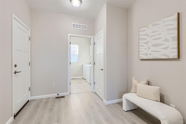 sitting room featuring light hardwood / wood-style floors