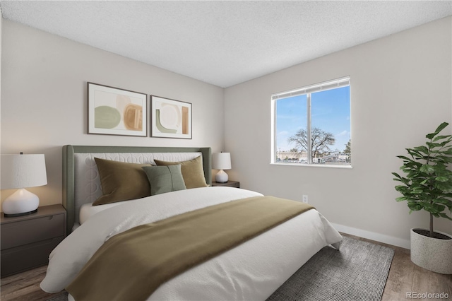 10211 Ura Ln Unit 1-202, Thornton, CO 80260 - bedroom with wood finished floors and baseboards