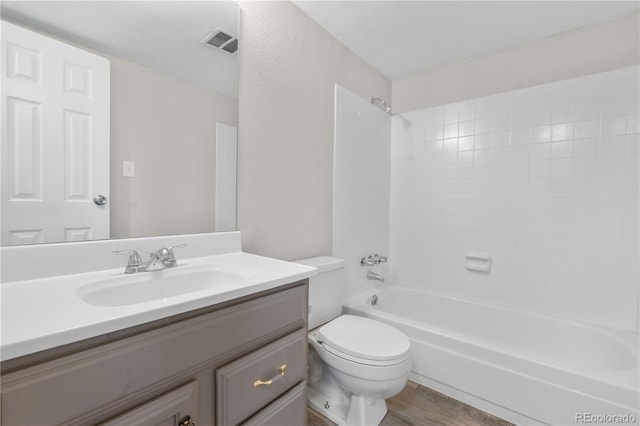 10211 Ura Ln Unit 1-202, Thornton, CO 80260 - full bath featuring toilet, vanity, shower / tub combination, and wood finished floors