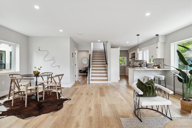 interior space with sink and light hardwood / wood-style floors