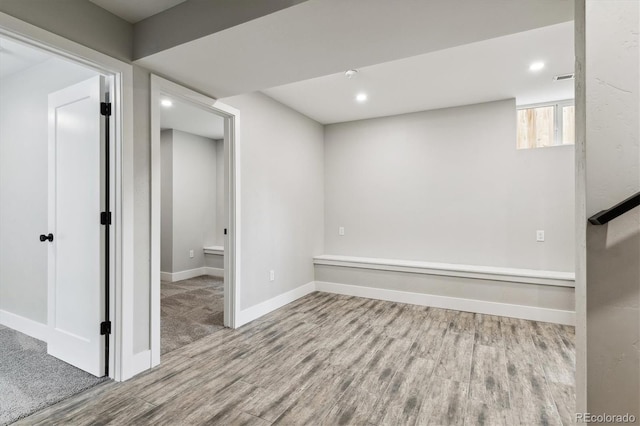 basement featuring light hardwood / wood-style floors