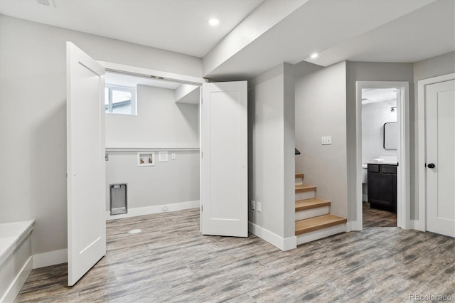 basement featuring light hardwood / wood-style floors