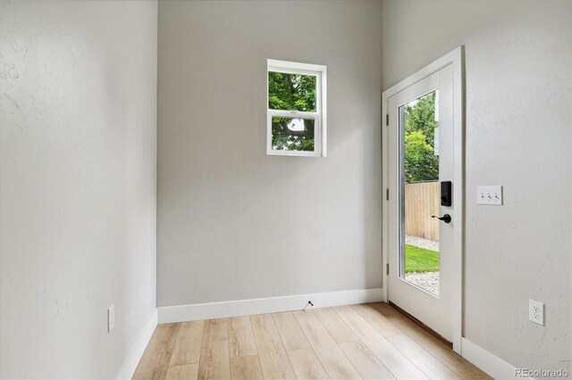 entryway with light hardwood / wood-style floors