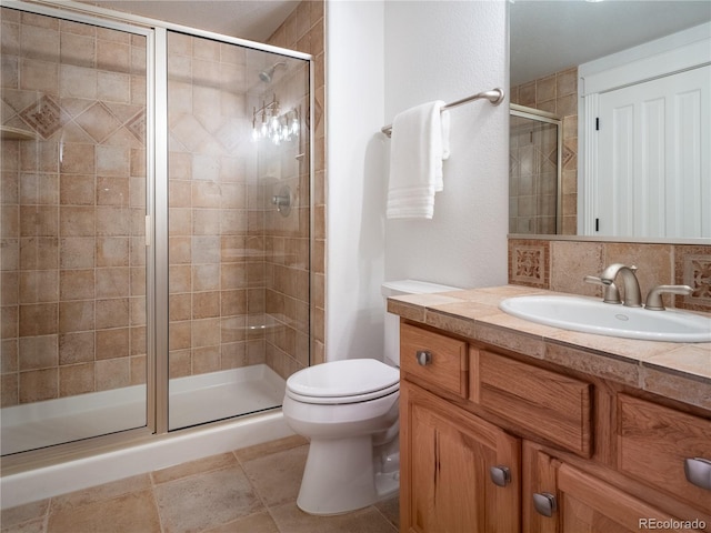 bathroom featuring decorative backsplash, toilet, walk in shower, and vanity