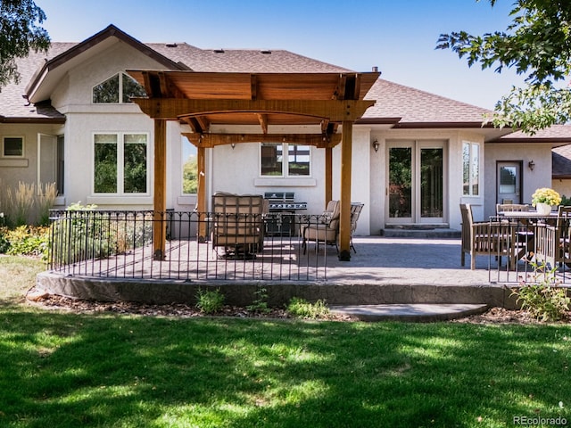 back of house featuring a yard and a patio area