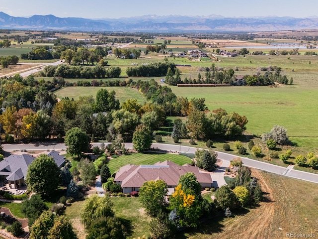 drone / aerial view with a mountain view and a rural view