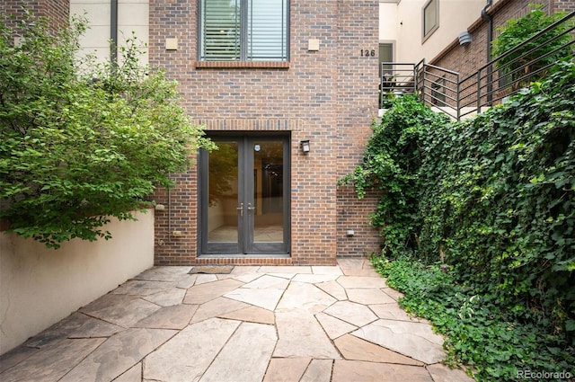 doorway to property featuring a patio area and french doors