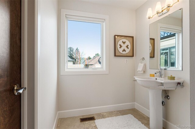 bathroom with tile patterned flooring