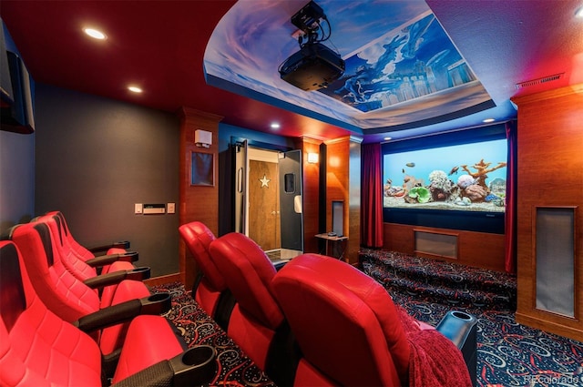 cinema room with a raised ceiling