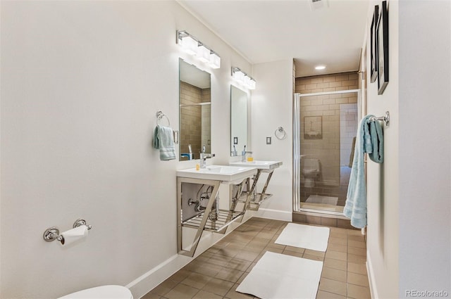 bathroom featuring sink, tile patterned floors, and a shower with shower door