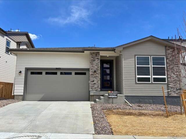 view of front of home with an attached garage and driveway