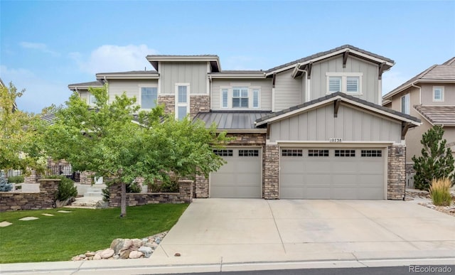 view of front of house with a front lawn and a garage