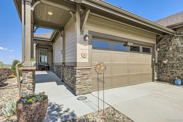 16459 W 86th Pl Unit B, Arvada, CO 80007 - entrance to property featuring stone siding, a shingled roof, and driveway