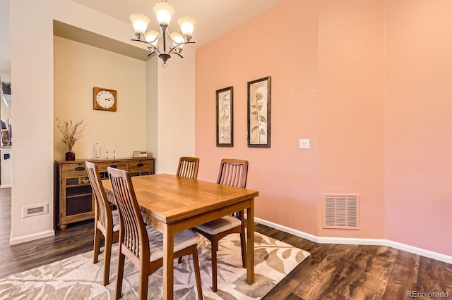 16459 W 86th Pl Unit B, Arvada, CO 80007 - dining space featuring wood finished floors, a chandelier, and baseboards