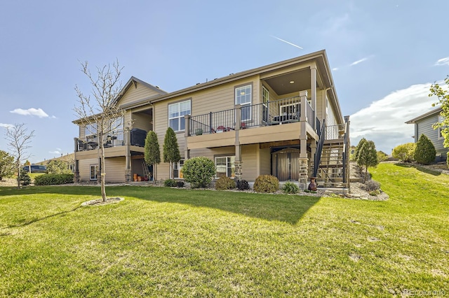 16459 W 86th Pl Unit B, Arvada, CO 80007 - rear view of property featuring a lawn and stairs