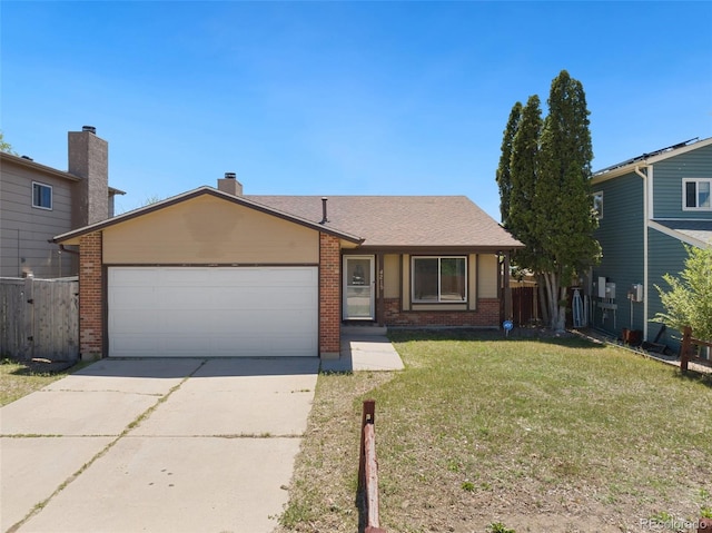 ranch-style home featuring a garage and a front lawn