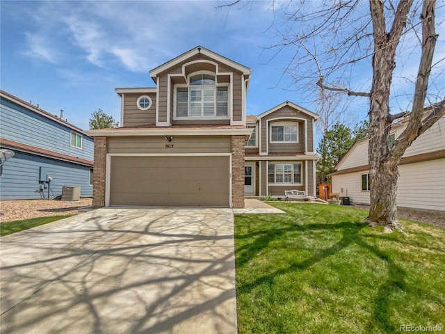 9115 W Hinsdale Pl, Littleton, CO 80128 - traditional home with an attached garage, a front lawn, driveway, and brick siding