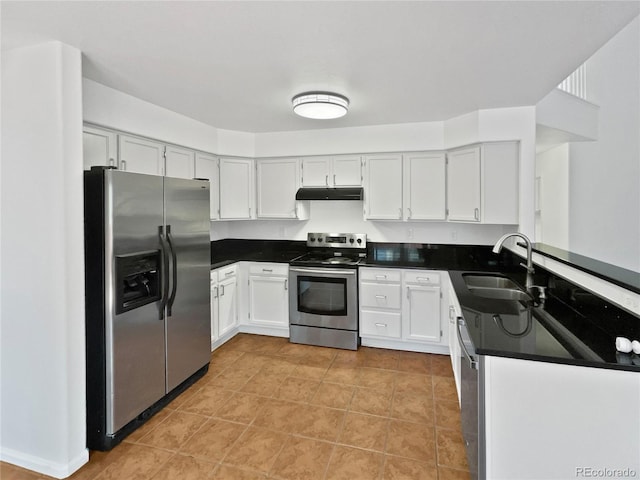 9115 W Hinsdale Pl, Littleton, CO 80128 - kitchen featuring dark countertops, a sink, stainless steel appliances, light tile patterned floors, and under cabinet range hood