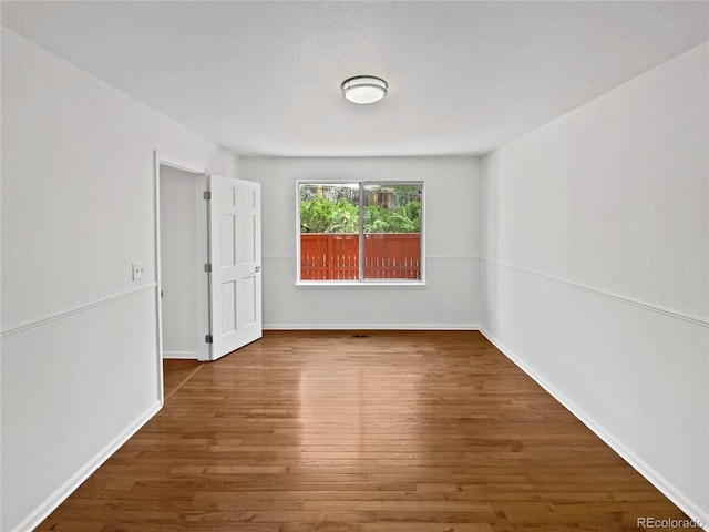 9115 W Hinsdale Pl, Littleton, CO 80128 - empty room with baseboards and wood finished floors