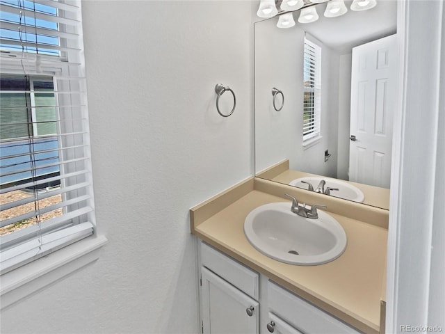 9115 W Hinsdale Pl, Littleton, CO 80128 - bathroom with a textured wall and vanity