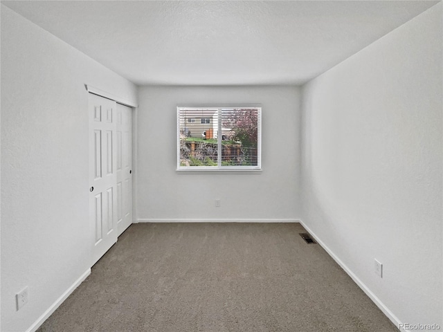 9115 W Hinsdale Pl, Littleton, CO 80128 - carpeted empty room featuring visible vents and baseboards