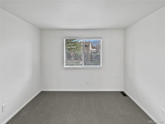 9115 W Hinsdale Pl, Littleton, CO 80128 - empty room with dark carpet, baseboards, and visible vents