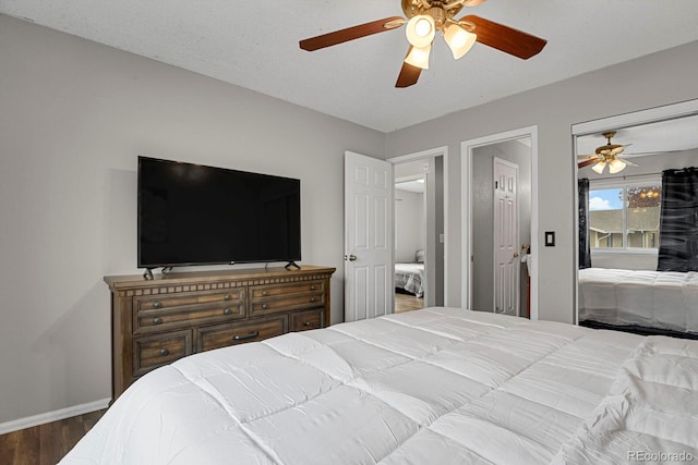 bedroom with wood-type flooring, a textured ceiling, and ceiling fan