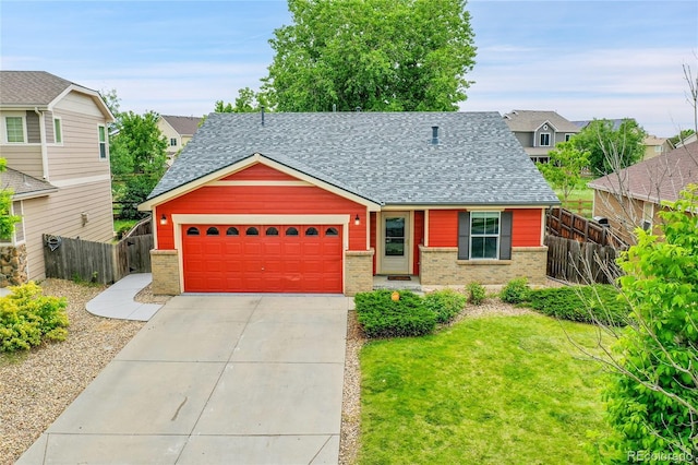 5577 Jasper St, Denver, CO 80239 - view of front of property featuring brick siding, roof with shingles, and an attached garage