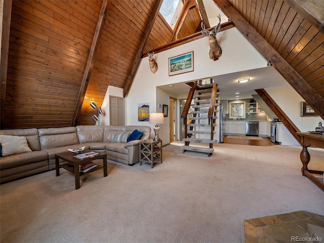 carpeted living room featuring beamed ceiling, high vaulted ceiling, wood ceiling, and a skylight