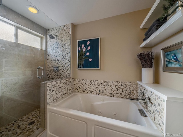 bathroom featuring shower with separate bathtub