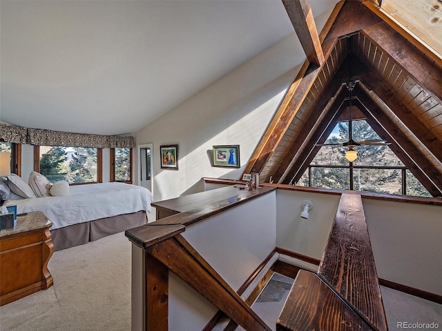 bedroom with vaulted ceiling, carpet floors, and wood ceiling