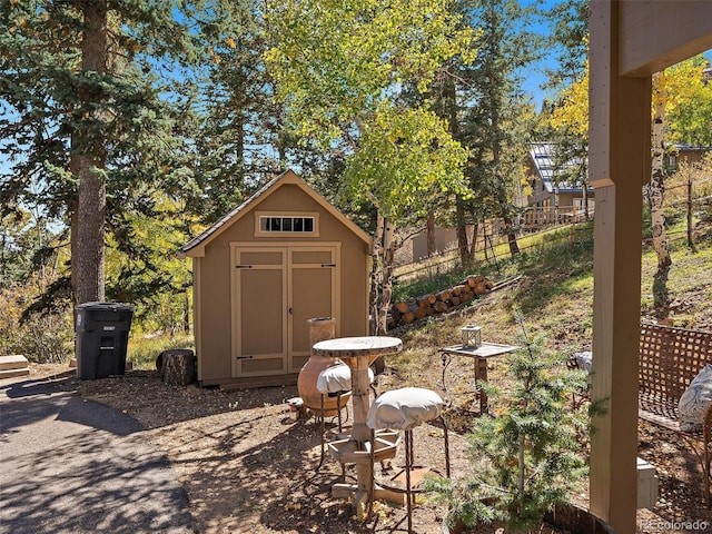 view of patio featuring a storage unit