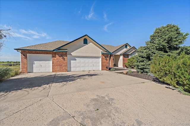 1248 Rawhide Cir, Elizabeth, CO 80107 - single story home with brick siding, an attached garage, and concrete driveway