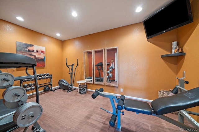 1248 Rawhide Cir, Elizabeth, CO 80107 - exercise area featuring wood finished floors, recessed lighting, and a textured wall