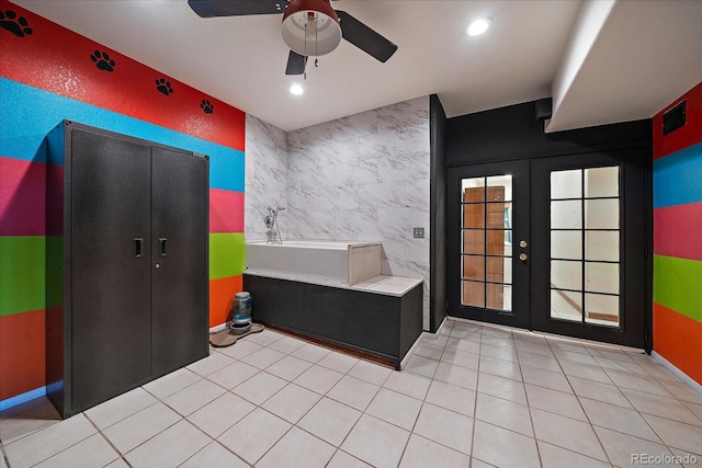 1248 Rawhide Cir, Elizabeth, CO 80107 - bathroom with french doors, a garden tub, ceiling fan, recessed lighting, and tile patterned floors