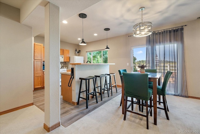 1248 Rawhide Cir, Elizabeth, CO 80107 - dining room with a chandelier, light carpet, and recessed lighting